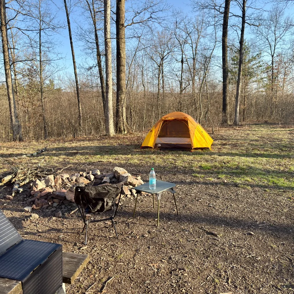 Tent, fire ring, and camp chair at site 30, Green Ridge State Forest