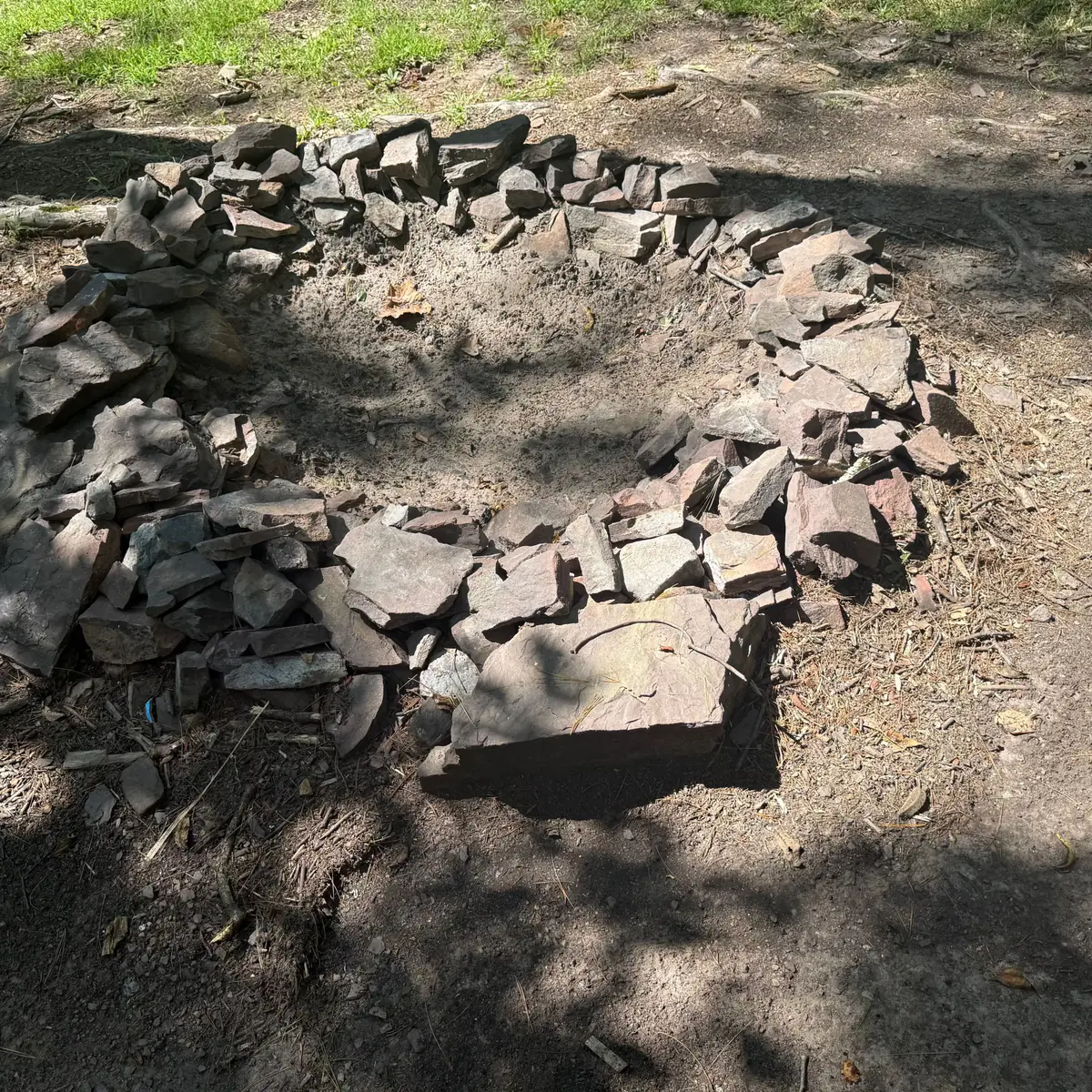 Campsite 88 at Green Ridge State Forest: the stone fire ring on the pitch.